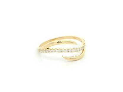 18K yellow gold diamond crossover ring featuring a flowing twist design set with 0.21 carat natural diamonds.