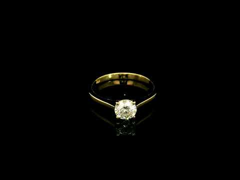 Round diamond solitaire engagement ring in 18K yellow gold with four-prong setting and tapered band