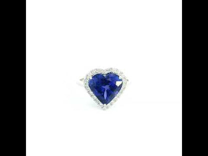 18K white gold heart tanzanite halo ring featuring a 5.89 Carat natural heart-shaped tanzanite surrounded by natural diamonds.