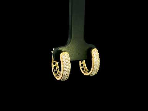18K yellow gold diamond huggie hoop earrings featuring 0.51 carat natural round brilliant pavé-set diamonds with a secure hinged closure.