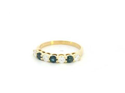 18K yellow gold half eternity ring featuring alternating natural blue sapphires and natural diamonds in a classic prong setting.