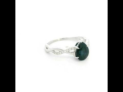 Pear shaped blue sapphire and diamond twist ring in 18K white gold