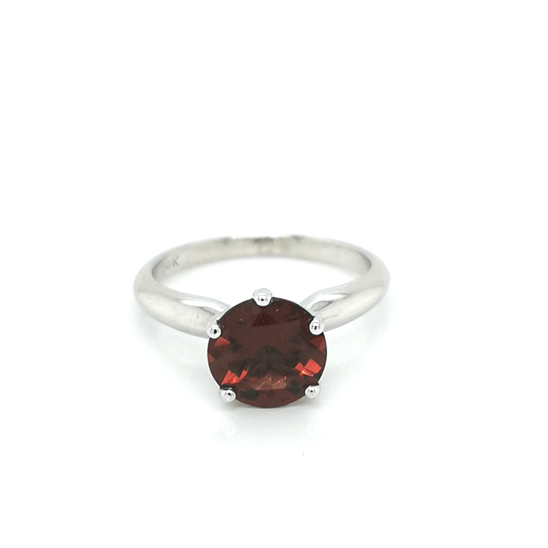 Solitaire Garnet Ring In 18k White Gold.