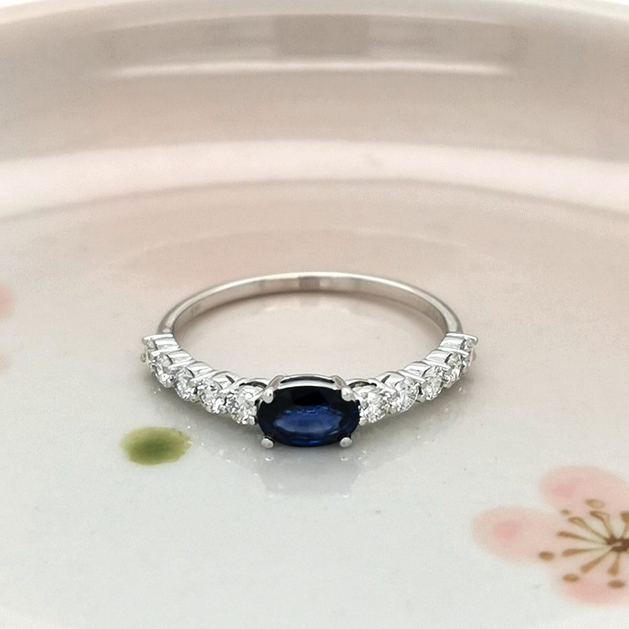 Solitaire Sapphire And Diamond Ring In 18k White Gold.