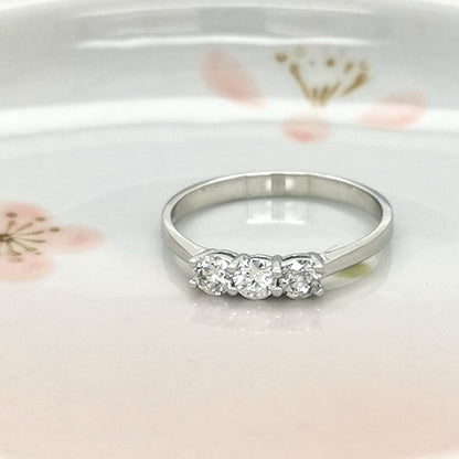 Three Diamond Ring In 18k White Gold.