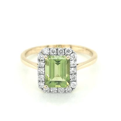 Peridot And Diamond Halo Ring In 18k Yellow Gold.