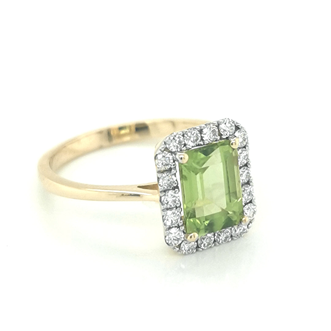 Peridot And Diamond Halo Ring In 18k Yellow Gold.