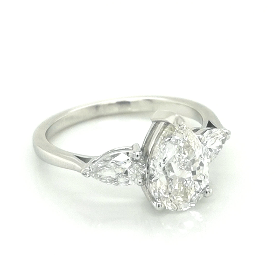 Three Pear Shape Diamond Ring In 18k White Gold.