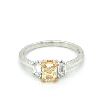 Fancy Yellow Diamond Ring With Trapezoid Side Stones In 18k White Gold.