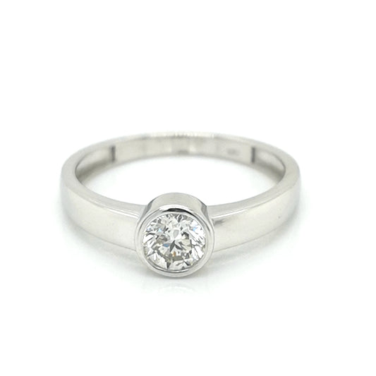 Bezel Set Solitaire Diamond Ring In 18k White Gold.