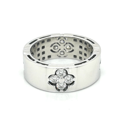 Flat, Pipe Cut Band Diamond Ring With A Floral Cluster In 18k White Gold.