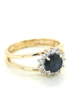 Round Sapphire And Diamond Halo Ring In 18k Yellow Gold.