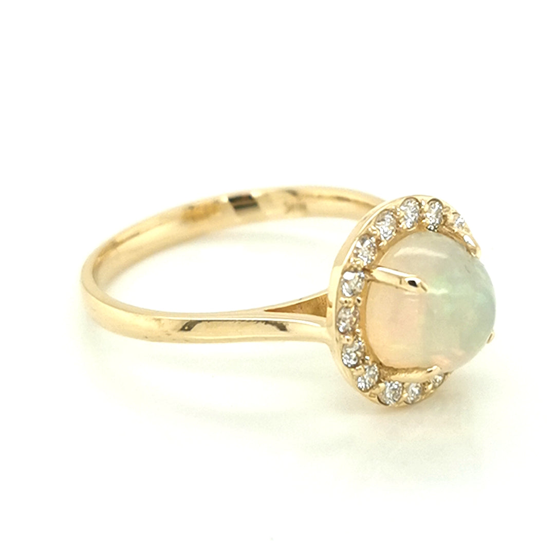 Round Opal And Diamond Halo Ring In 18k Yellow Gold.