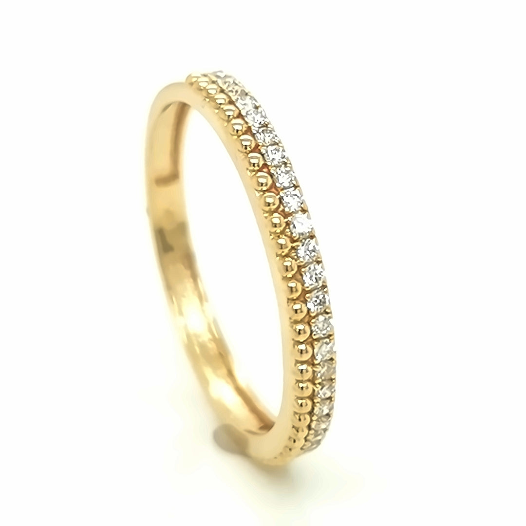 Eternity diamond ring in 18k yellow gold.