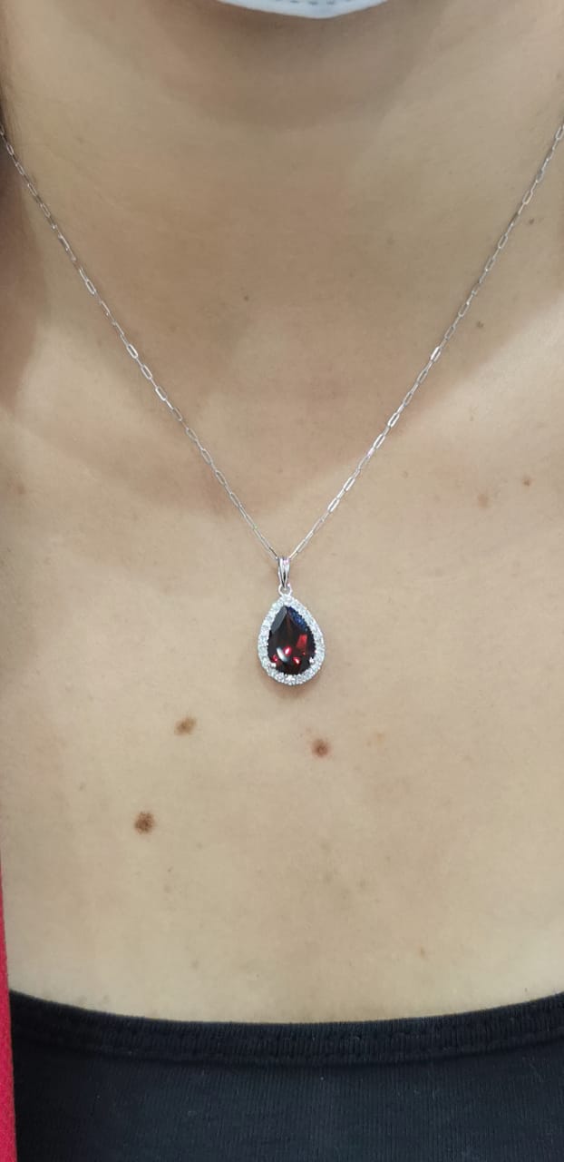 Pear Shape Garnet And Diamond Pendant Crafted In 18K White Gold