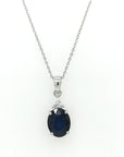 Oval Shape Blue Sapphire Pendant Crafted In 18K White Gold