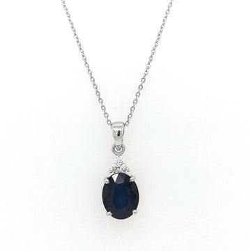 Oval Shape Blue Sapphire Pendant Crafted In 18K White Gold