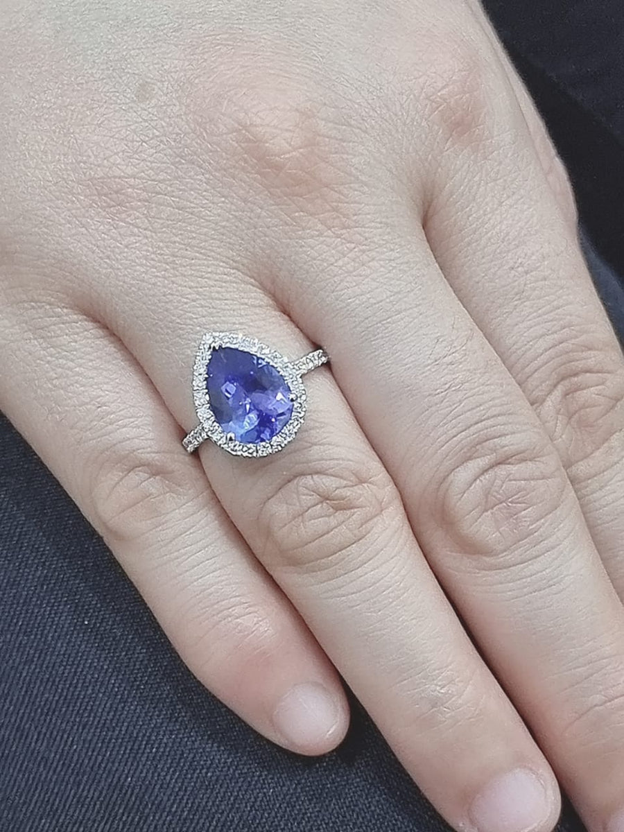 Halo Tanzanite And Diamond Ring Crafted In 18k White Gold