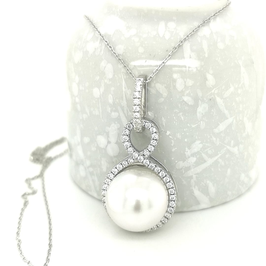 Infinity Design Pearl And Diamond Pendant In 18k White Gold.