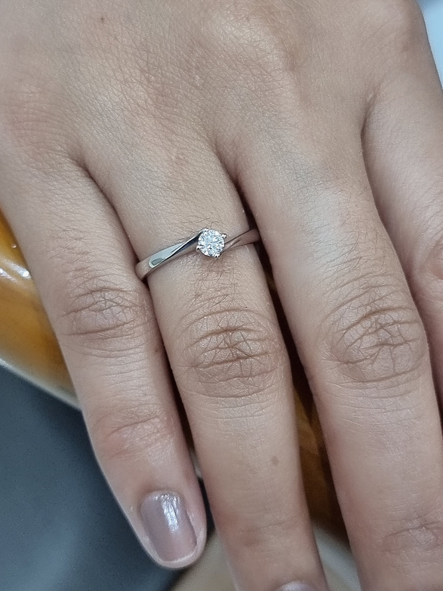 Twisted Round Cut Solitaire Diamond Ring In 18k White Gold