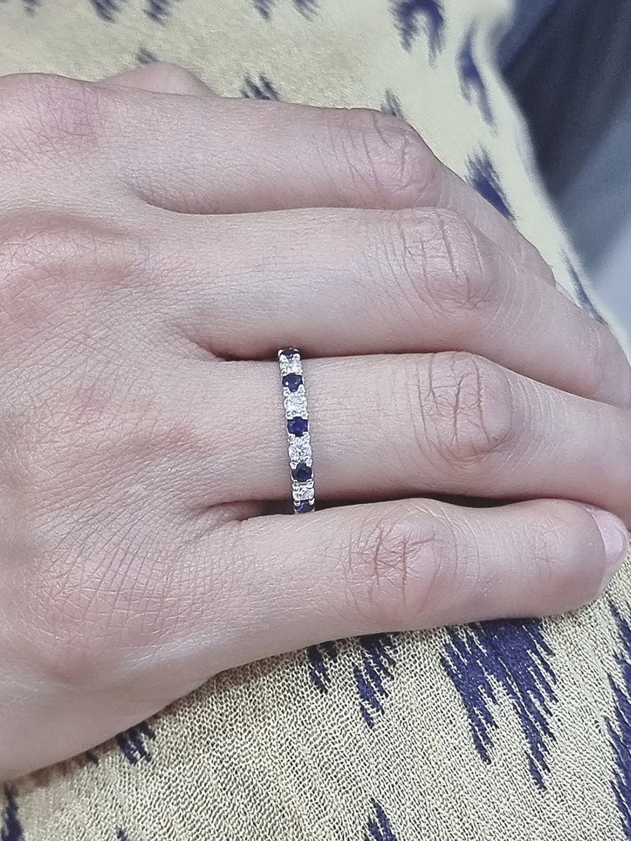 Expertly Crafted Band Featuring The Most Exquisite Round Cut Sapphires Alternating With Round Cut Diamonds. A Perfect Compliment For A Sapphire Engagement Ring Or Can Be Worn Styling With Other Rings To Make A Beautiful Ring Stack. 