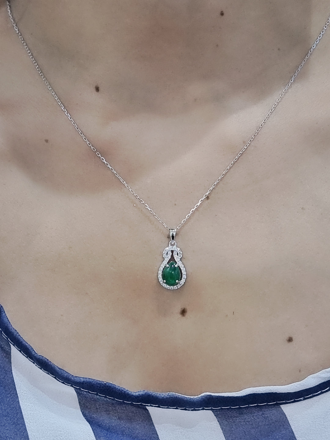 Emerald And Diamond Pendant In 18k White Gold.