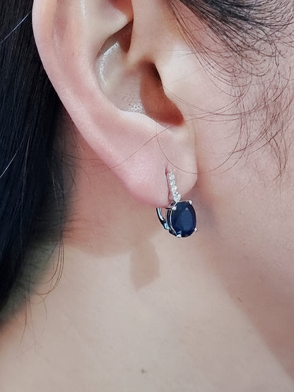 Oval Sapphire And Diamond Earrings In 18k White Gold.