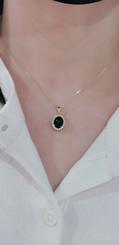 Cabochon Emerald With Diamond Halo Pendant In 18k Yellow Gold.
