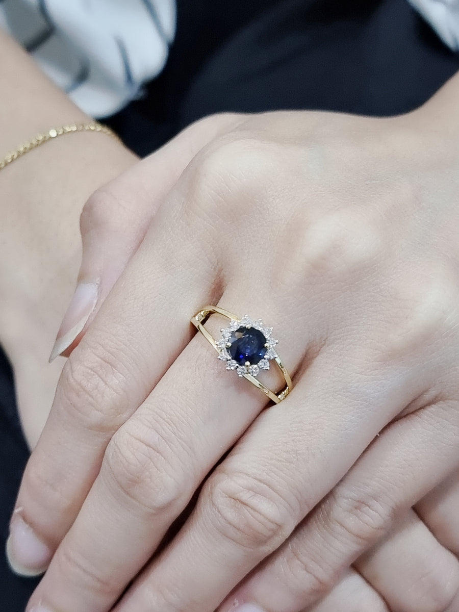 Round Sapphire And Diamond Halo Ring In 18k Yellow Gold.