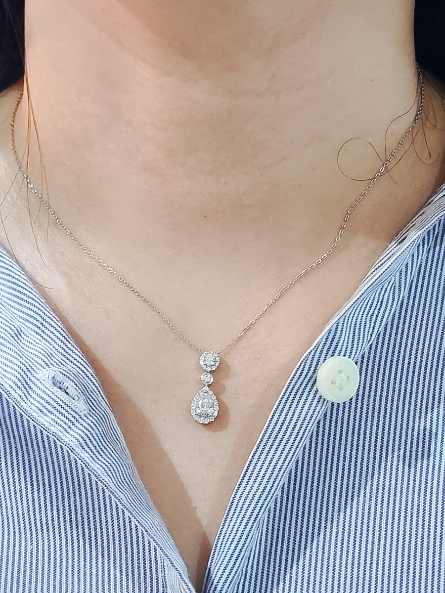 A Diamond Necklace Is An Essential Part Of A Woman's Jewellery Collection, And This Pendant Necklace Is A Great Way To Add A Little Sparkle... Featuring A Modern Design With A Beautiful Combination Of Pear And Round Cut Diamonds. Crafted In 18k White Gold And Comes With A Chain. 