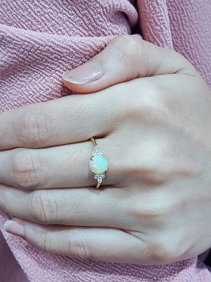 Round Opal And Diamond Ring In 18k Yellow Gold.