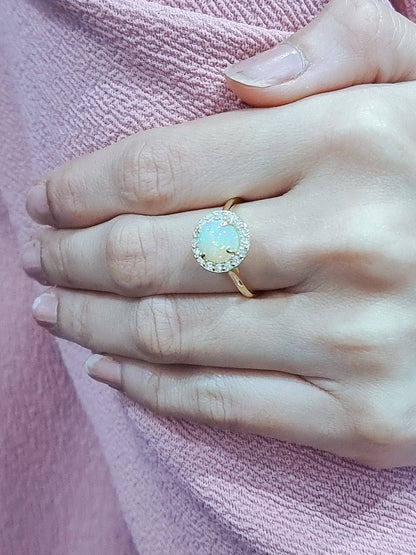 Round Opal And Diamond Halo Ring In 18k Yellow Gold.