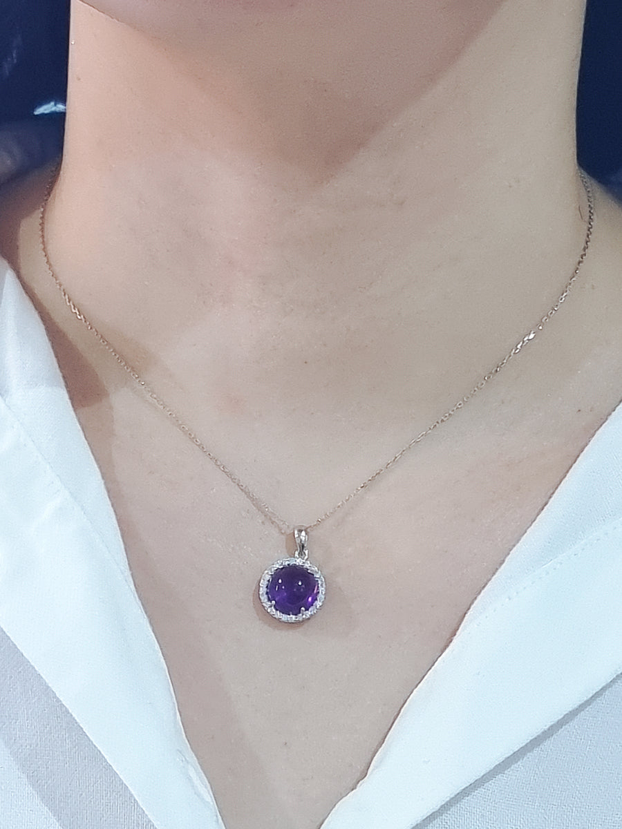 Cabochon Amethyst With A Diamond Halo Pendant In 18k White Gold.