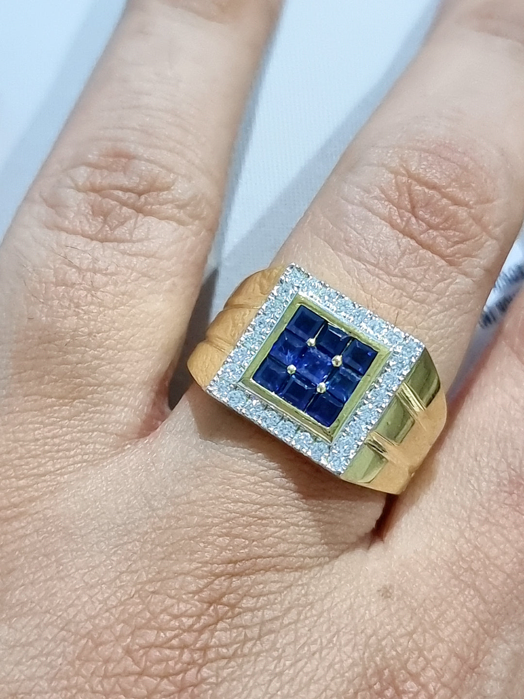 mens diamond and sapphire ring in 18k yellow gold.