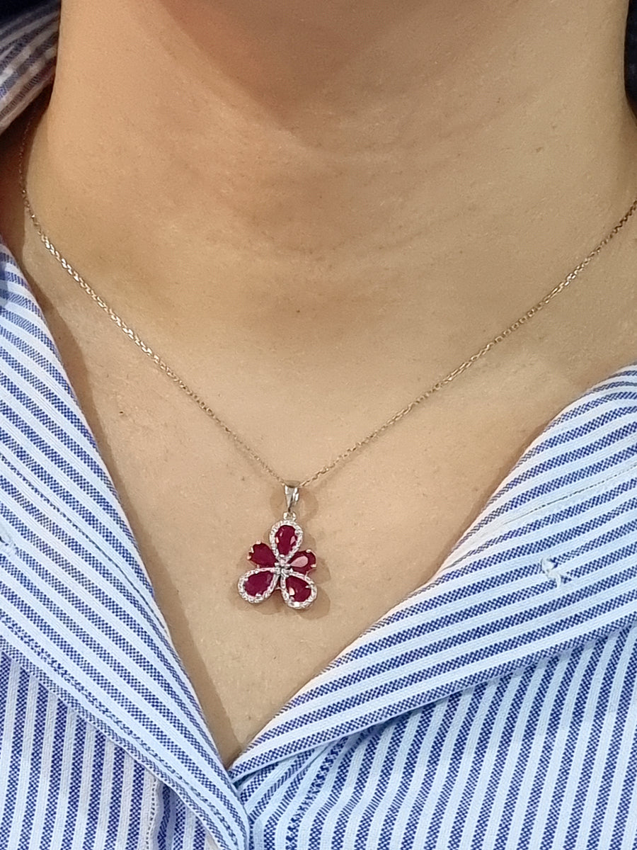 July Birthstone, Ruby And Diamond Flower Pendant In 18k white Gold.