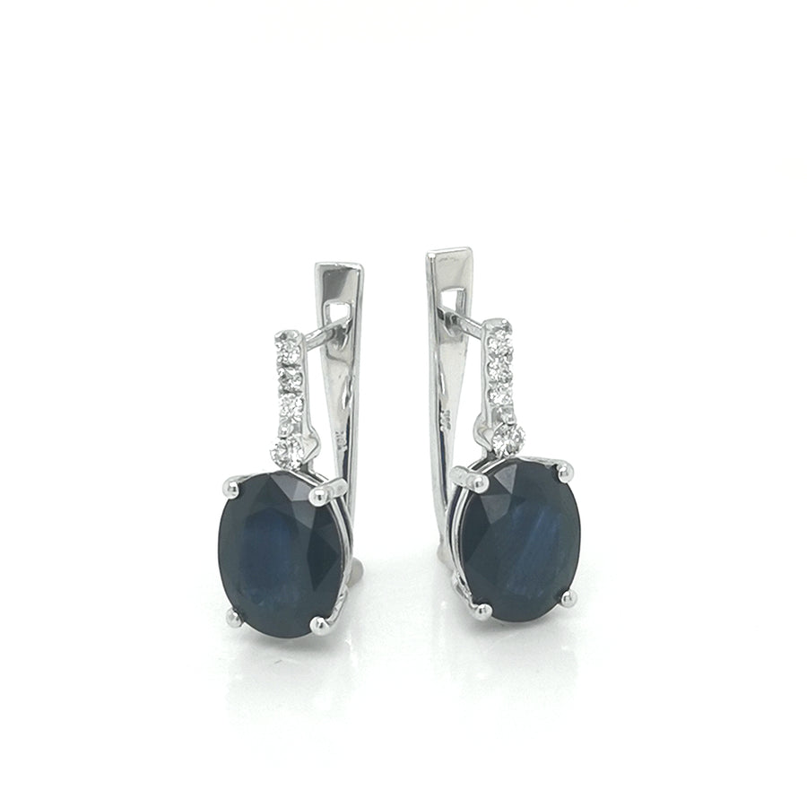 Oval Sapphire And Diamond Earrings In 18k White Gold.