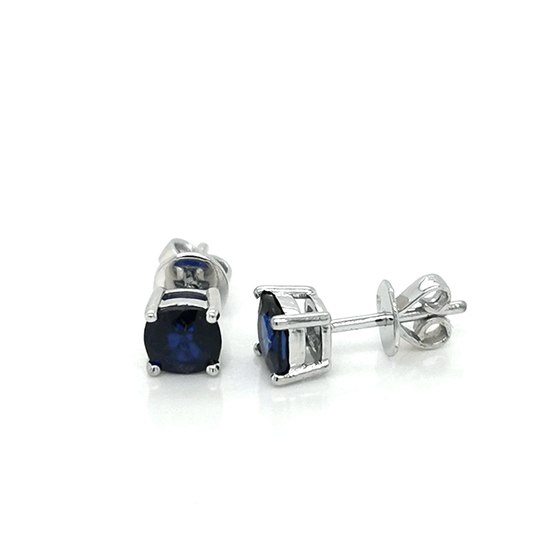 Solitaire Sapphire Stud Earrings In 18k White Gold.