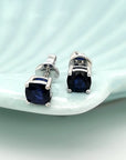 Solitaire Sapphire Stud Earrings In 18k White Gold.