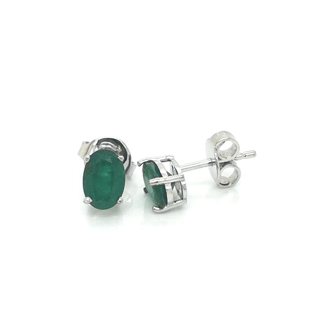 Solitaire Emerald Stud Earrings In 18k White Gold.