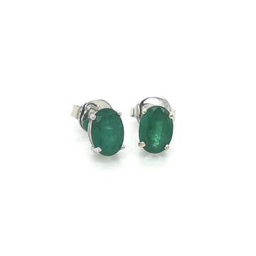 Solitaire Emerald Stud Earrings In 18k White Gold.