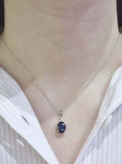 Oval Shape Blue Sapphire Pendant Crafted In 18K White Gold