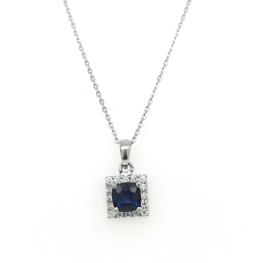 Halo Sapphire And Diamond Pendant In 18k White Gold.