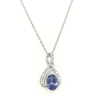 Tanzanite And Diamond Pendant In 18k White Gold.