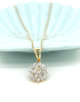 Floral Motif Diamond Cluster Pendant In 18k Yellow Gold.