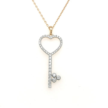 Diamond Key Pendant In 18k Yellow Gold.