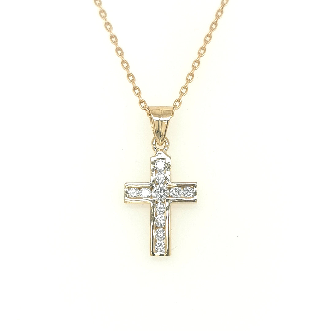 This Is A Classic 18ct Yellow Gold And Diamond Cross Pendant, Embellished With 0.30 Carats Of Channel Set Round Cut Diamonds Affixed To A Highly Polished Bale. This Pendant Comes Without A Chain, So You Can Customize It With A Chain Of Your Choice. 