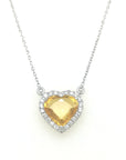 Embrace the warmth of love with this heart-shaped yellow sapphire and diamond pendant, delicately cradled in the embrace of lustrous 18k white gold. The vivid yellow sapphire, a radiant symbol of joy and prosperity, captivates the heart with its enchanting hue, while the surrounding diamonds add a celestial sparkle, making this pendant a true expression of love and elegance that will forever shine brightly close to your heart.