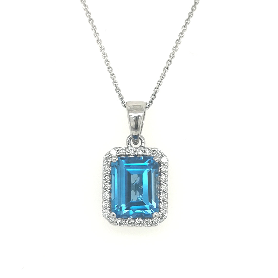 Blue Topaz And Diamond Pendant In 18k White Gold.